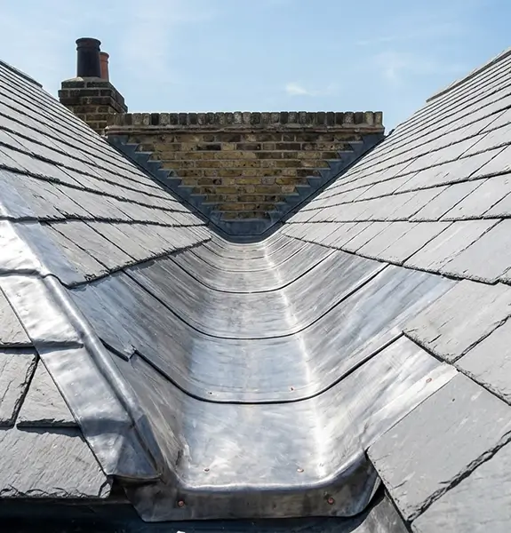 Roof cleaning and leadwork on a tiled roof